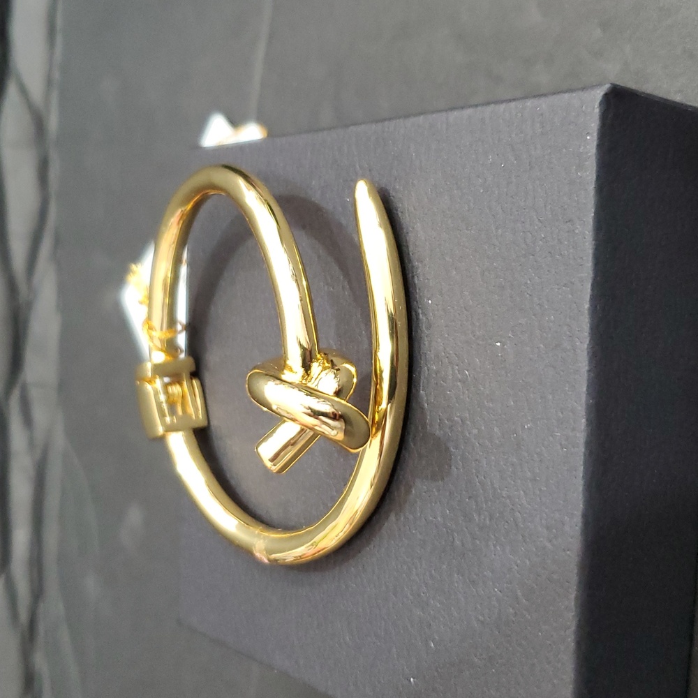 Eye Candy gold tone knot and point open‎ cuff hinged bracelet bangle brand new